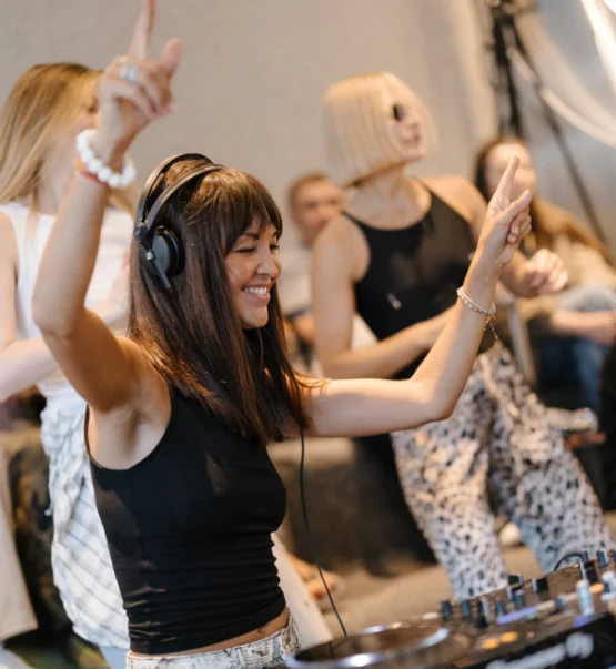 Friends and a DJ celebrating together at DOT. Warsaw
